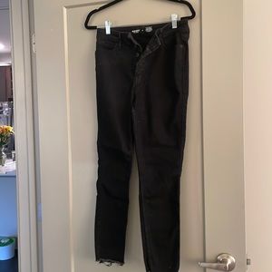 Black button fly skinny jeans